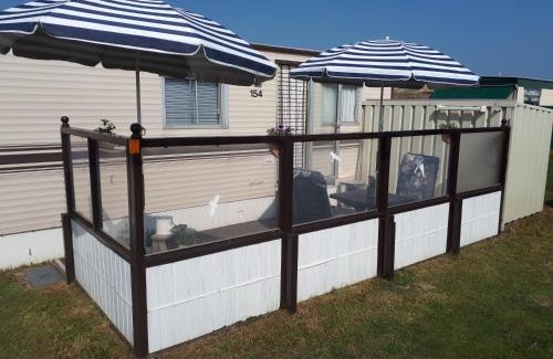 Nes House | AMELAND-Nes-Duinoord: Stacaravan (chalet) + fietsen direct aan zee!