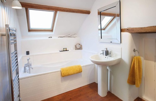 Ash Mill Cottage | An open plan cottage with a private patio with views of the countryside.