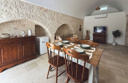 Valenzano House | Ancient Trullo surrounded by greenery in the heart of Valle D'Itria