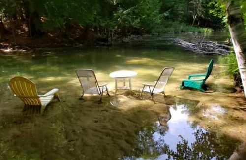 Lake Ann Apartment | And a River Runs Through It….