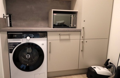 Dorumer Neufeld Apartment | Ankerpunkt Südost - Ferienwohnung mit Garten und Sauna