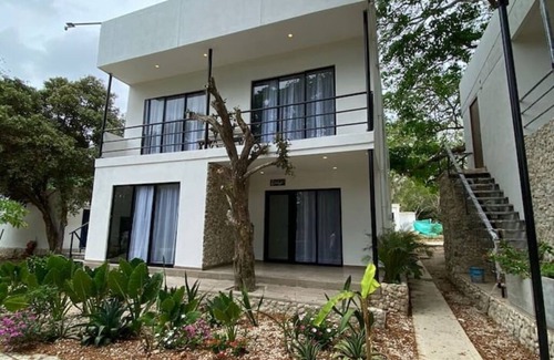 Tierra Bomba Island Apartment | Apartment 3 with balcony and view of the tropical garden