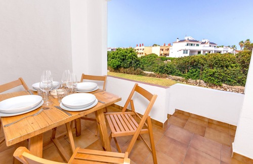 Los Delfines Apartment | Apartment 'De Playa En Ciutadella' with Shared Pool, Shared Garden and Wi-Fi