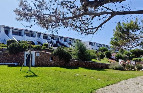 Arenal d'en Castell Apartment | Apartment with beautiful sea views, gardens, swimming pool and very well located.