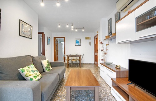 Grao de Gandia Apartment | Apartment 'Playamar I' with Shared Pool, Shared Garden and Air Conditioning