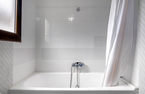 Grao de Gandia Apartment | Apartment 'Playamar I' with Shared Pool, Shared Garden and Air Conditioning