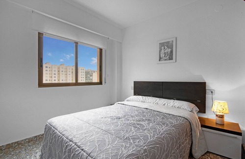 Grao de Gandia Apartment | Apartment 'Playamar I' with Shared Pool, Shared Garden and Air Conditioning