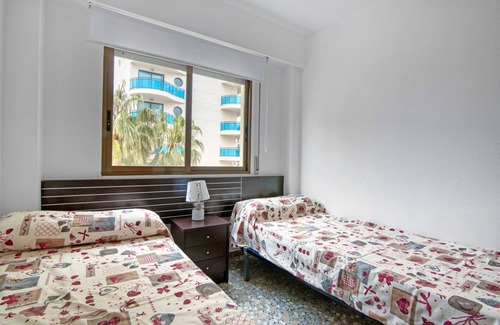 Grao de Gandia Apartment | Apartment 'Playamar I' with Shared Pool, Shared Garden and Air Conditioning