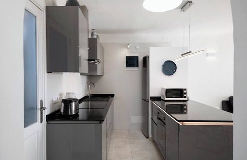 Playa Blanca Apartment | Apartment "Puerto Chico Q" with Sea View, Shared Pool, Terrace, A/C & Wi-Fi