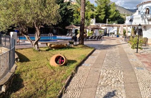 La Canuta Apartment | Apartment 'Sunsea Village V' with Mountain View, Shared Pool and Private Terrace