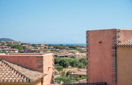 Porto San Paolo Apartment | Apartment 'Tavolara Porto San Paolo E2' with Sea View, Shared Pool and Air Conditioning