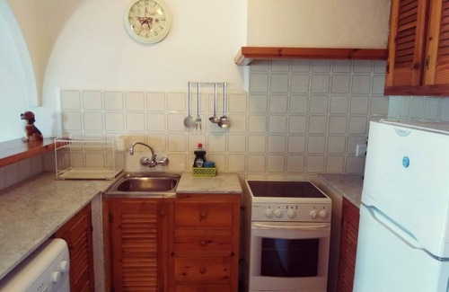 Arenal d'en Castell Apartment | Apartment with Private Pool, Garden and Sea Views