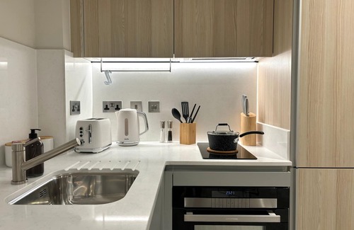 Fairfield Apartment | Apartment with Workspace and Sky Library