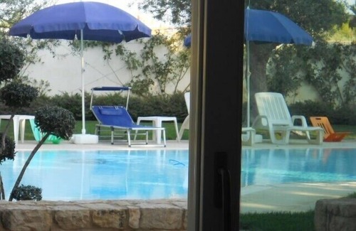 Donnalucata Apartment | Apartment with heated saltwater pool, private garden, air conditioning, WiFi