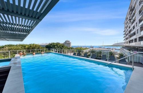 Cairns Central Business District Apartment | Aqua Vista at Harbour Lights Poolside Panorama
