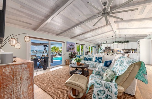 Stuart House | Aquatopia North: Riverfront beach house, w/dock, heated pool + hot tub & more!