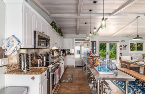 Stuart House | Aquatopia North: Riverfront beach house, w/dock, heated pool + hot tub & more!
