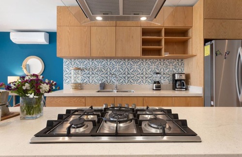 Cabo Bello Apartment | Arch views, Infinity Pool, Cozy, Close to Beaches