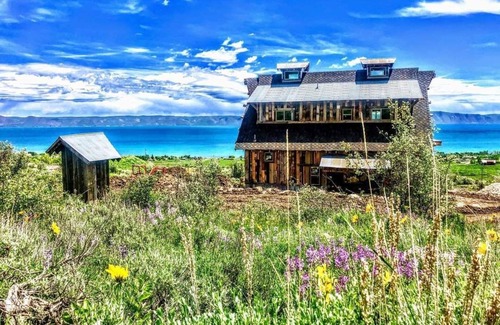 Fish Haven House | Artistry barn where the building is a work of reclaimed art with amazing views