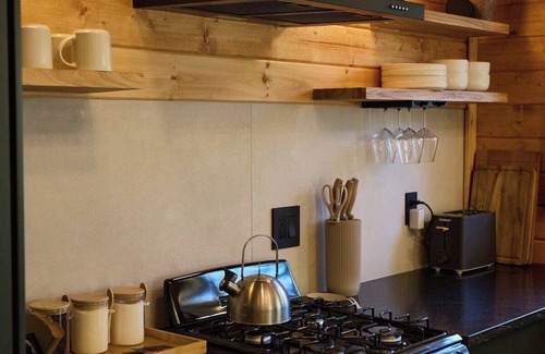 Florissant Cabin | Aspen Hideaway · Mountain Modern log Cabin Deck + Hot Tub