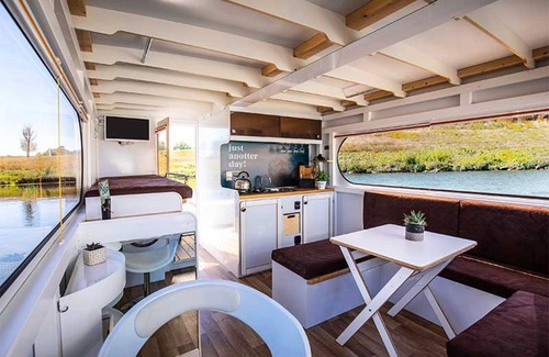 Ophoven Boat Rental | Attractive houseboat in Kinrooi with terrace