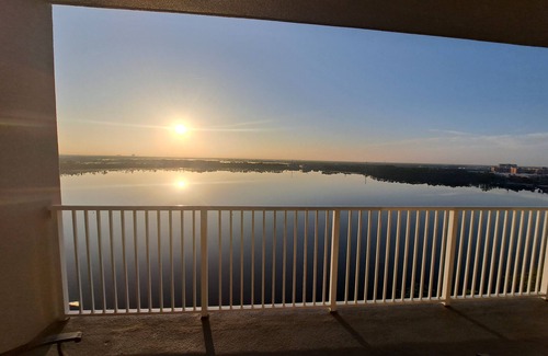 Florida Central Atlantic Coast Condo | AVAILABLE OCT 1-6; 21-25 2.5 BDR 2 BTH 25 FT LAKE VIEW BALCONY & DISNEY FIREWORK