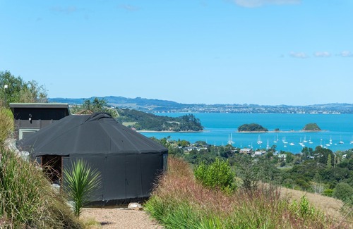 Palm Beach Cabin | Awaawa Yurts - Combined - 3 Yurt Package - Awaawa Yurts offer a luxury glamping experience on Waiheke Island. Stunning views, luxury queen sized bed, private bathroom with tea and coffee making facilities.