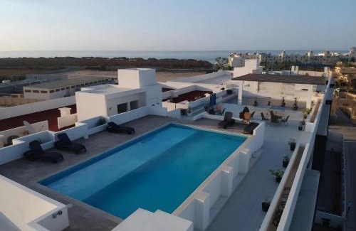 El Tezal Apartment | Bahia del Tezal 103b, 1BR Modern condo big rooftop pool walk to beach through Riu hotel