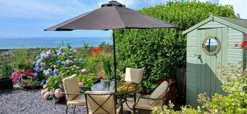 Pendine House | Bay View - holiday cottage by the sea with stunning views