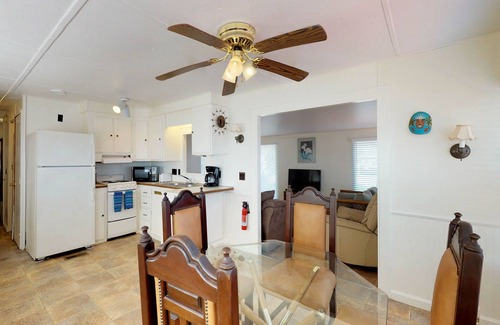 Port Isabel House | Bayfront park model home with deck, pool, hot tub, gym, tennis, & golf