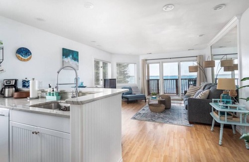 Traverse City Apartment | Beach Bliss 211 Balcony Water Views Beach Downtown