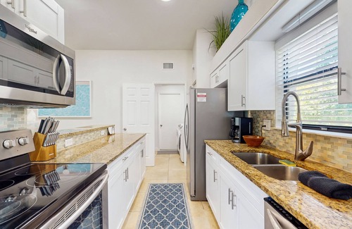 Naples Park House | Beach home with outdoor sundeck, hot tub, enclosed yard & patio
