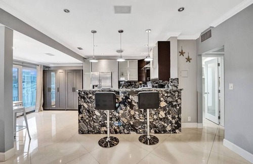 Hendricks and Venice Isles Apartment | Beach Isles: Modern 1BR Waterfront Apartment with Patio