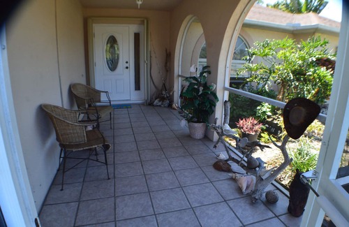 Pelican House | Beach themed tropical Pool Home, family fun and pet friendly.