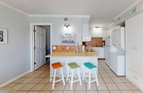 Panama City Beach Condo | Beachfront condo with a kitchen, located in a gated resort featuring pools, hot tub, and a tiki bar!