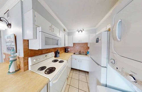 Panama City Beach Condo | Beachfront condo with a kitchen, located in a gated resort featuring pools, hot tub, and a tiki bar!