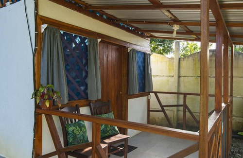 Manzanillo Cabin | Beachfront Casita for 2, loft-style double bed & kitchenette with shaded porch