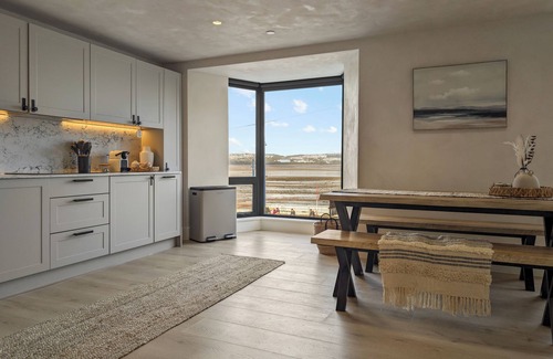 Mumbles Apartment | Beachfront eco-friendly apartment with ocean view and modern interior sleeping up to 6