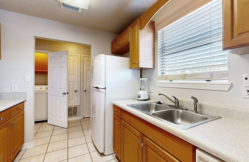 Sugar Beach House | Beachfront townhome w/on-site beach access, heated pool, patio, grill, AC, W/D