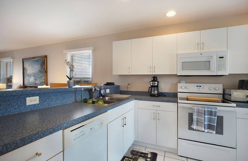 Pelican Apartment | Beautiful 4 unit building on Lake Louise with a private pool.