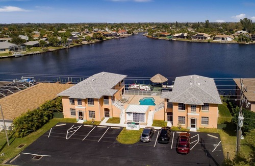 Pelican Apartment | Beautiful 4 unit building on Lake Louise with a private pool.