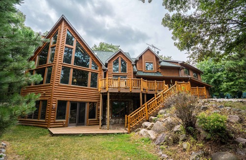 Wild Rose House | Beautiful 8000 Sq. Ft. Log Home With 250 Feet Of Private Frontage on Kusel Lake