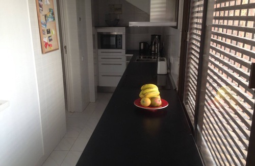 Playa del Aguila House | Beautiful bungalow with generous kitchen, sea view and beach/sea access