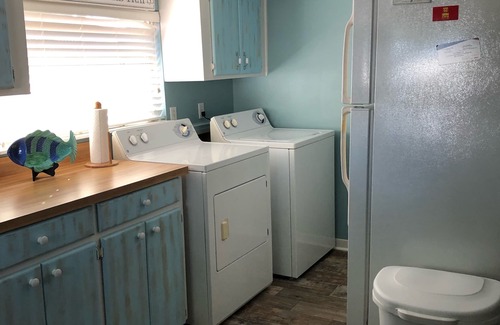 Horseshoe Beach House | Beautiful Canal Front, Nautical Theme Home with downstairs outdoor TIki Bar
