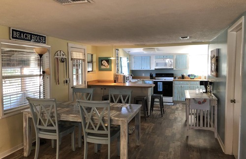 Horseshoe Beach House | Beautiful Canal Front, Nautical Theme Home with downstairs outdoor TIki Bar