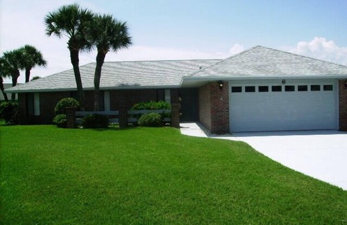 Ormond Beach House | Beautiful home steps to the beach with year round heated pool and spacious lanai