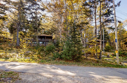 Boothbay Harbor Cabin | Beautiful, rustic cabin overlooking Lewis Cove with porch, deck & fireplace