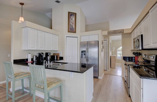 Bonita Springs House | Beautiful Tropical Inspired Pool Home in Private Community <2 Miles To Beach