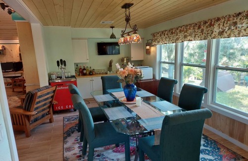Palm City House | Beautiful Waterfront Hideaway Gem on Bessy Creek w/Swim Spa, Tiki Bar Boat Lift