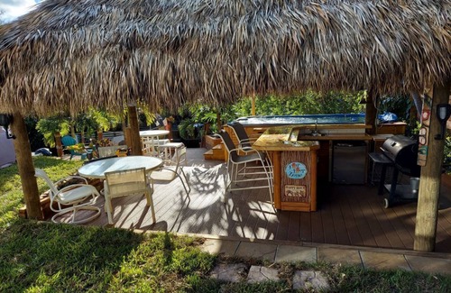 Palm City House | Beautiful Waterfront Hideaway Gem on Bessy Creek w/Swim Spa, Tiki Bar Boat Lift